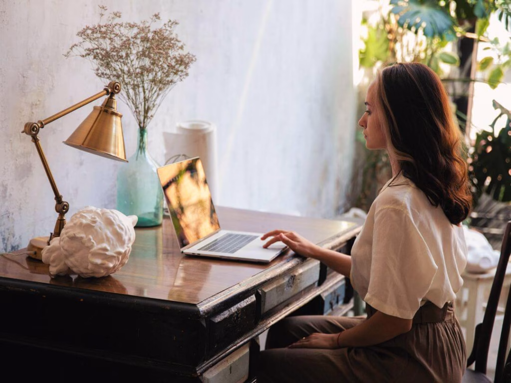 Person on laptop working on content writing and copywriting.