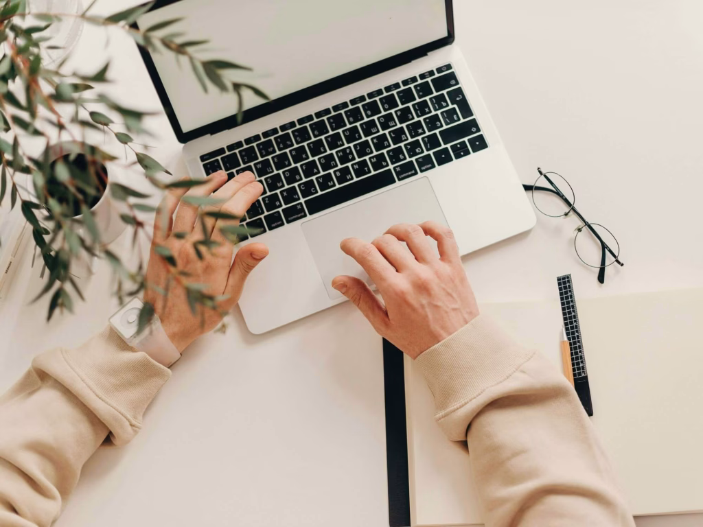 Person at desk working on a marketing strategy.