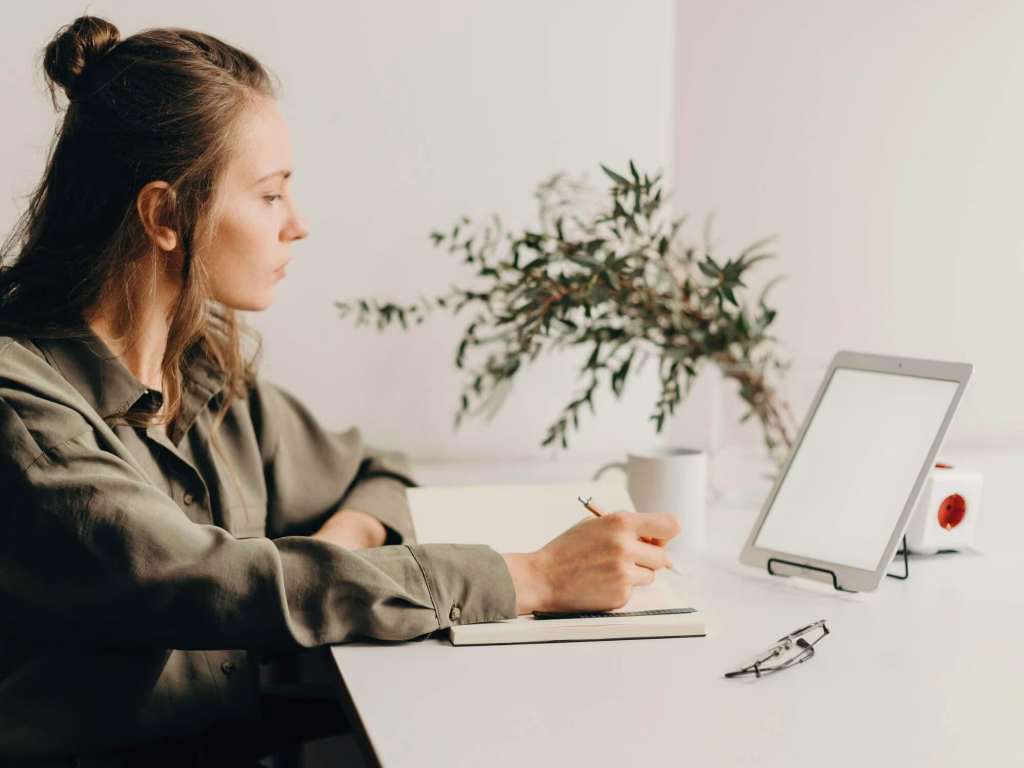 Person at desk working on a marketing strategy.