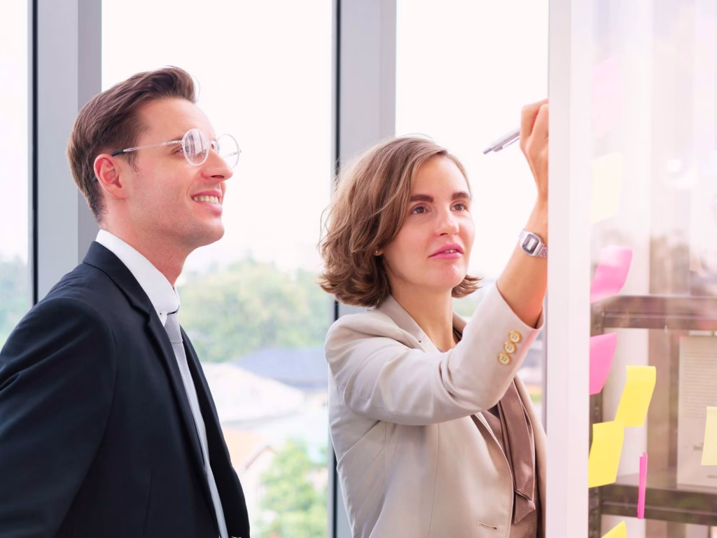Persons discussing the creative brief.