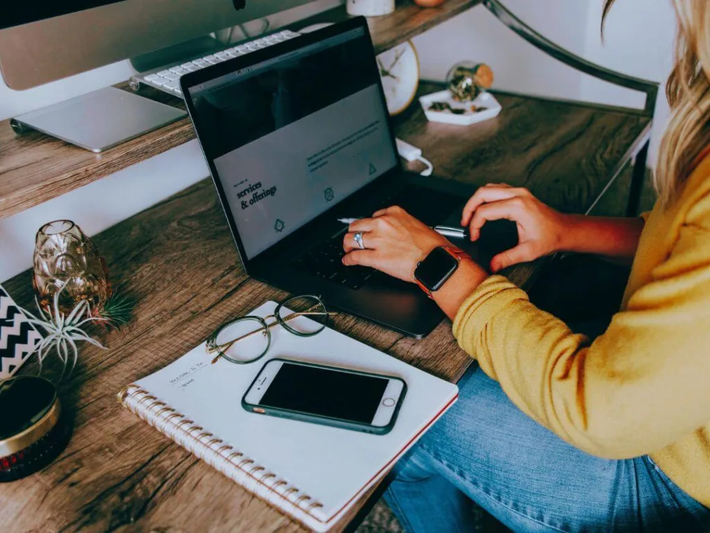Person a laptop working on a creative business.
