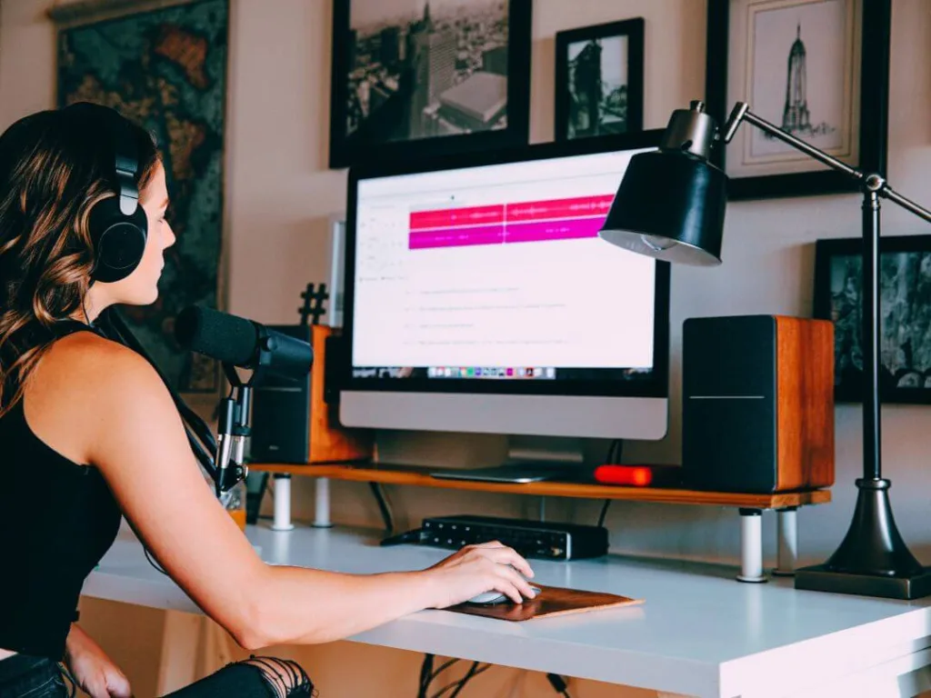 Person at desk working on a podcast.