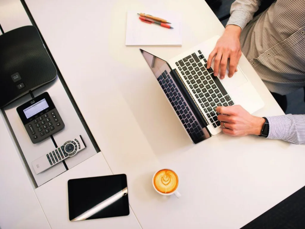 Person on laptop working on faceless marketing.