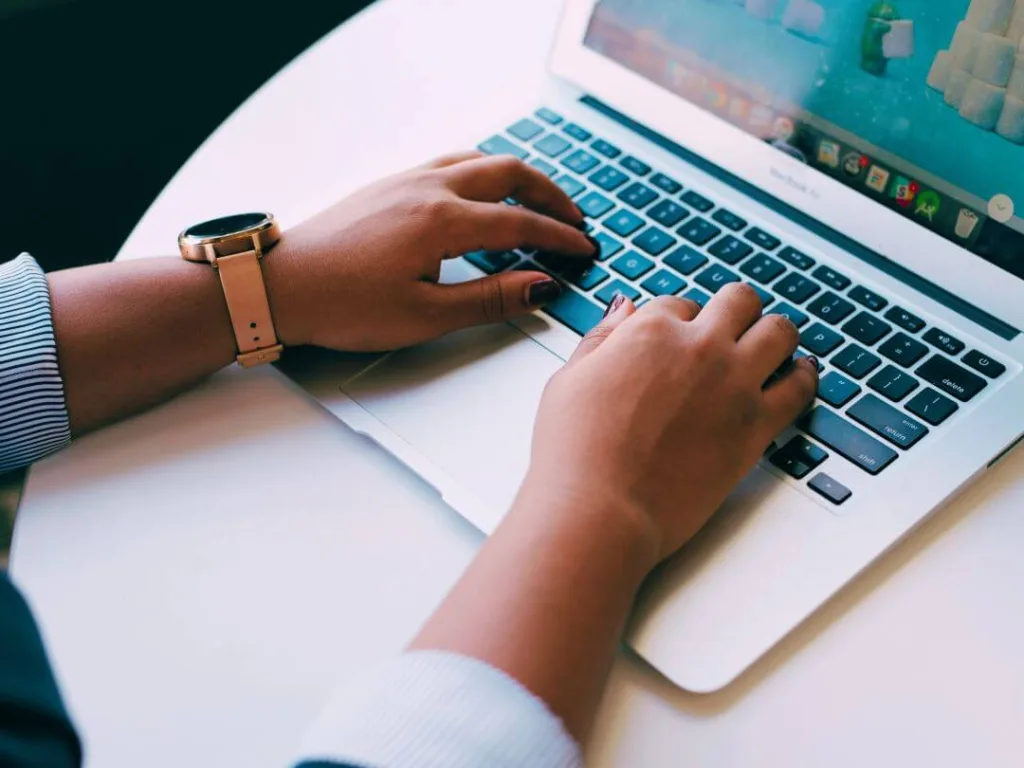 Person on laptop working on faceless marketing on Instagram.