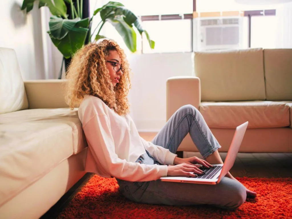 Person on laptop learning about headlines.