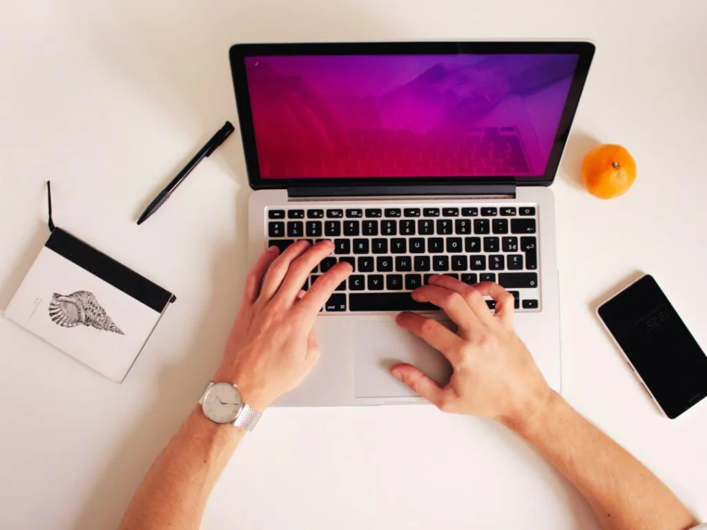 Person laptop working on headlines for their blog.