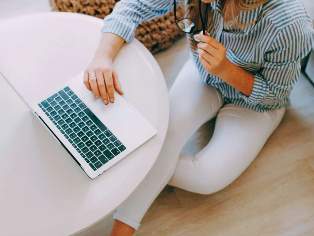 Person on laptop working on content writing.