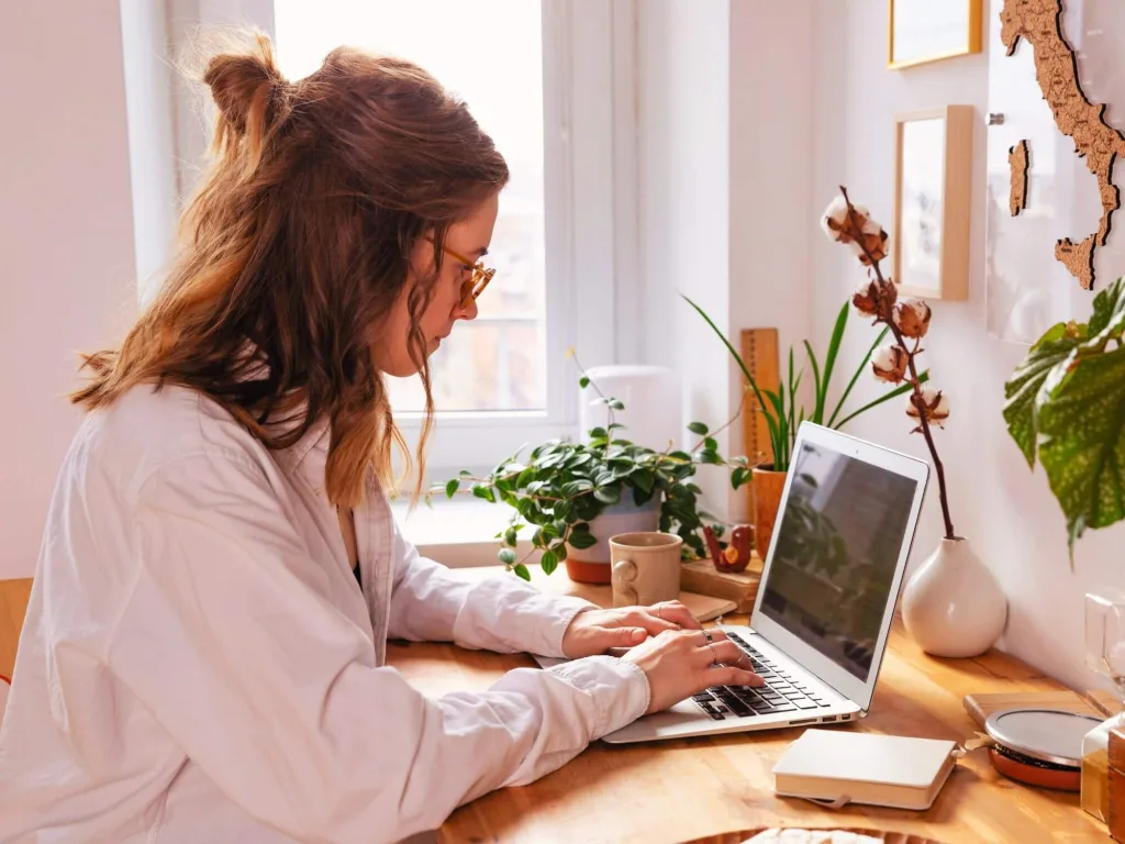 Lead Generation Strategy How to Optimize Your Process 2 1 – Azura Person on laptop working on lead generation strategy.