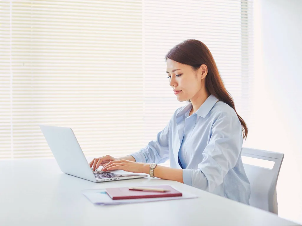 Lead Generation Strategy How to Optimize Your Process 3 1 – Azura Person on laptop working on lead generation strategy.