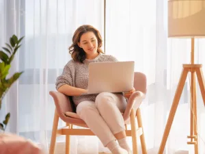 Person using laptop to work on AI-powered lead generation.