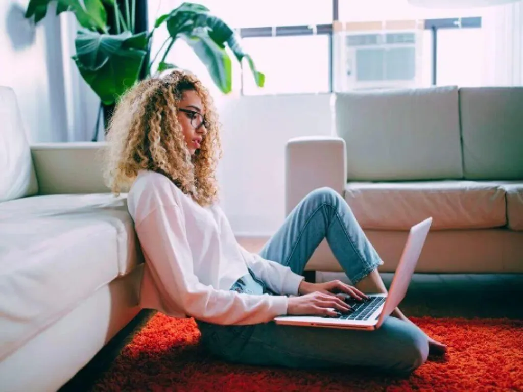 Person on laptop working on niche markets.