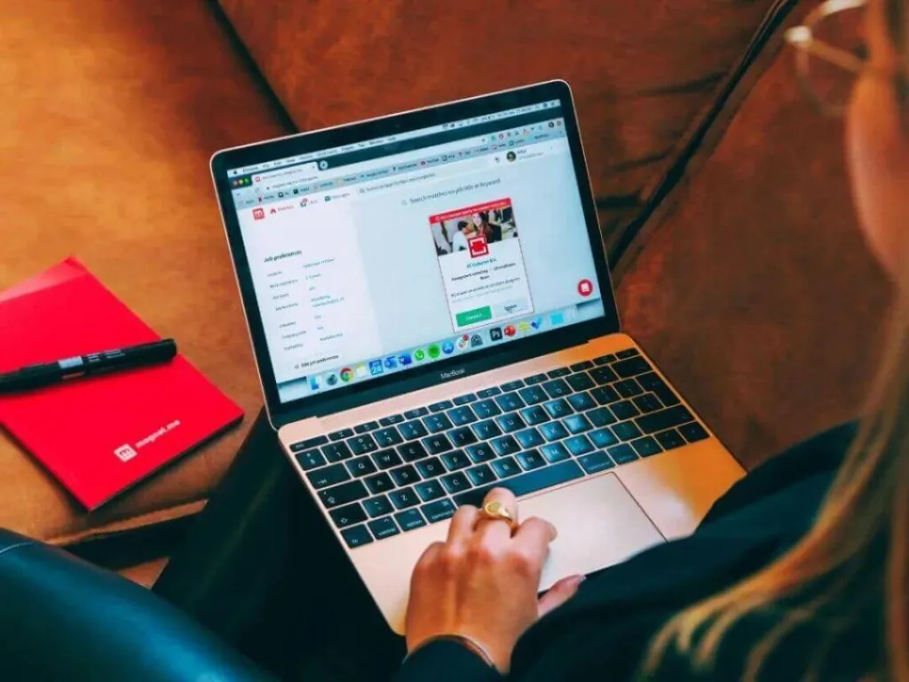 Person on laptop working on niche markets.