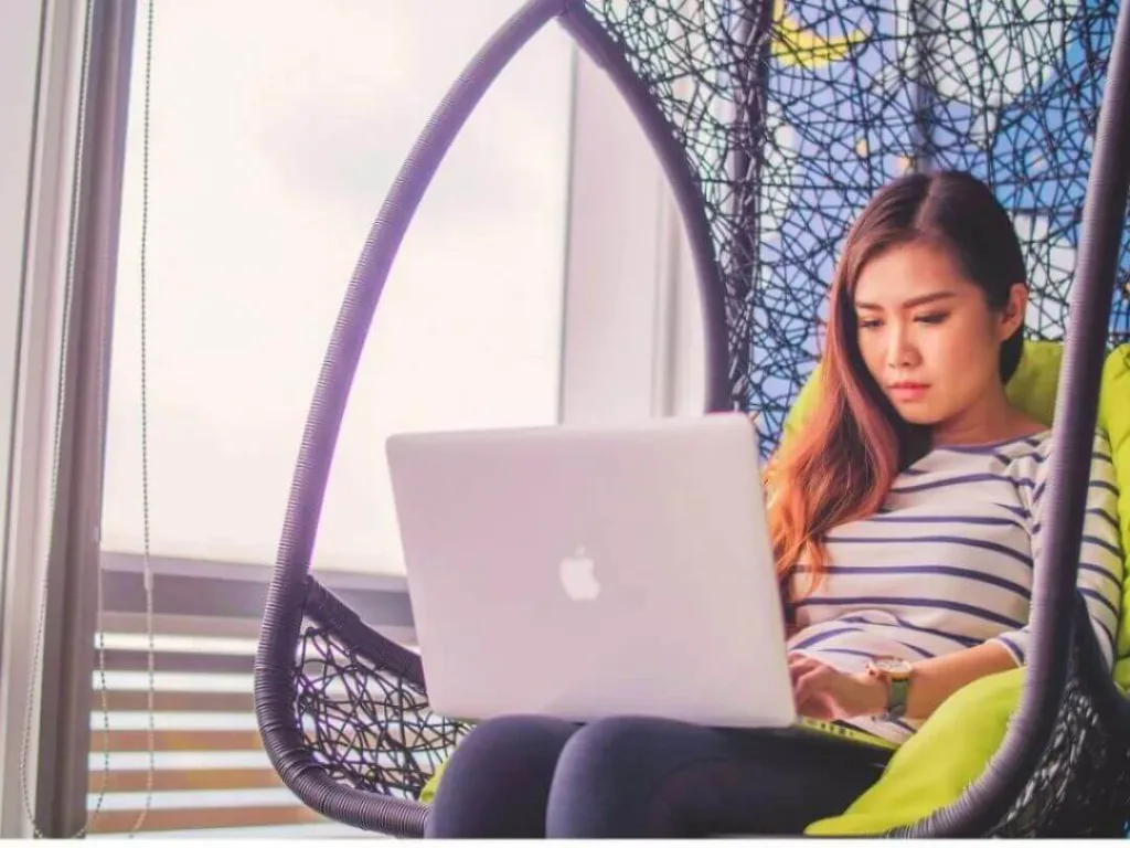 Person on laptop working on niche markets.
