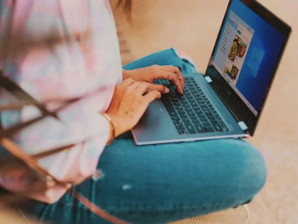 Person on laptop working on SEO for a press release.