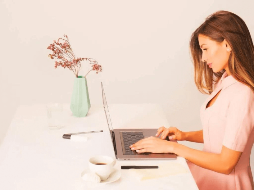 Person on laptop learning about CRM.