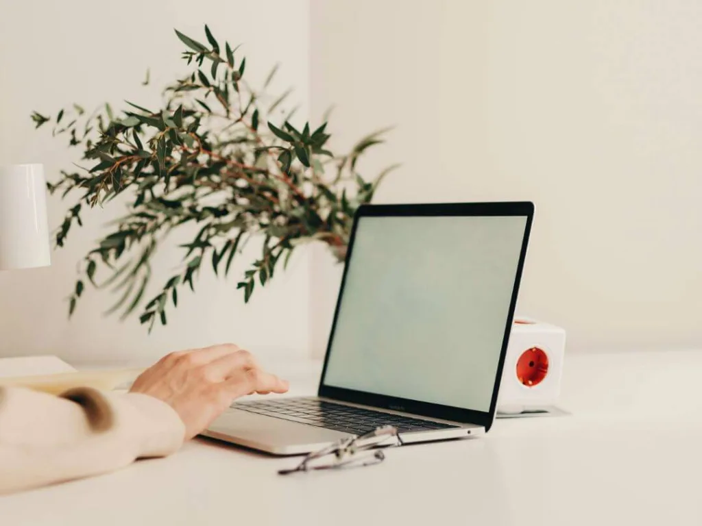 Content Strategy How to Master Audience Analysis 2 1 – Azura Person on laptop working on content strategy.