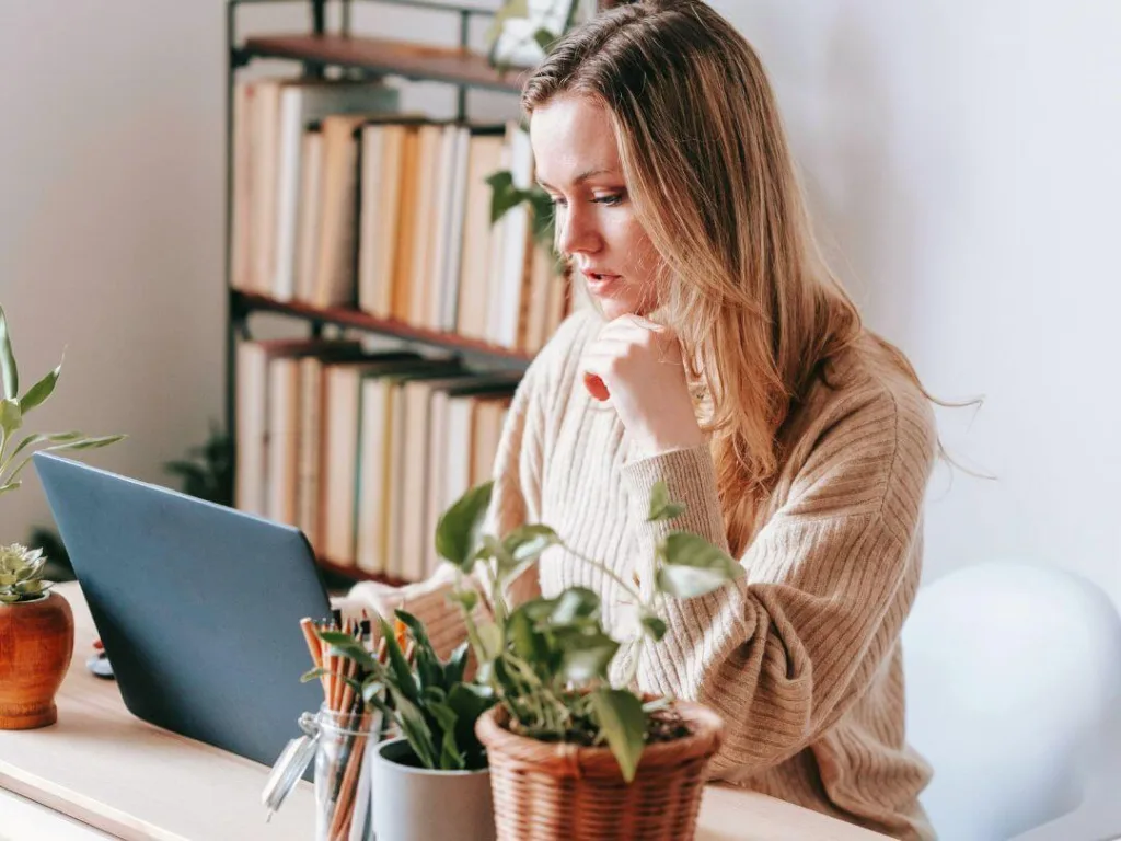 Content Strategy How to Master Audience Analysis 3 1 – Azura Person on laptop working on content strategy.