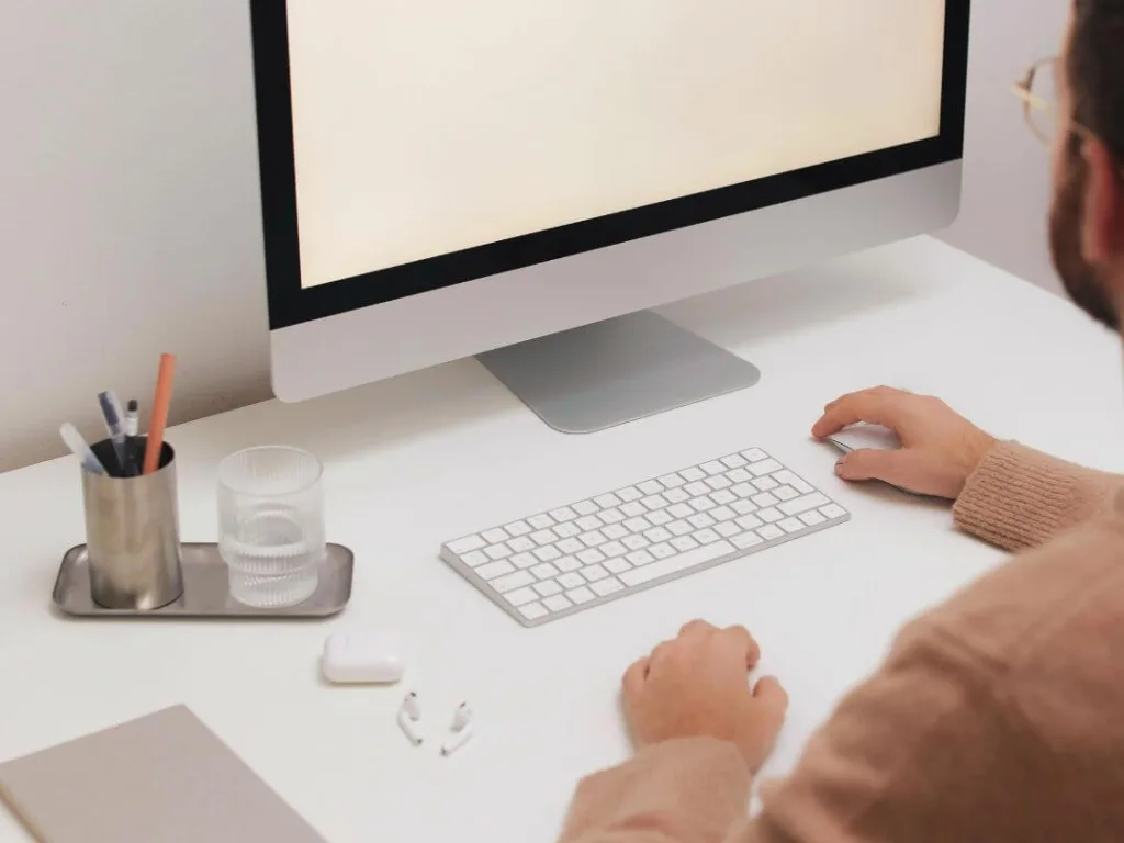 Person on computer working on a brand voice.