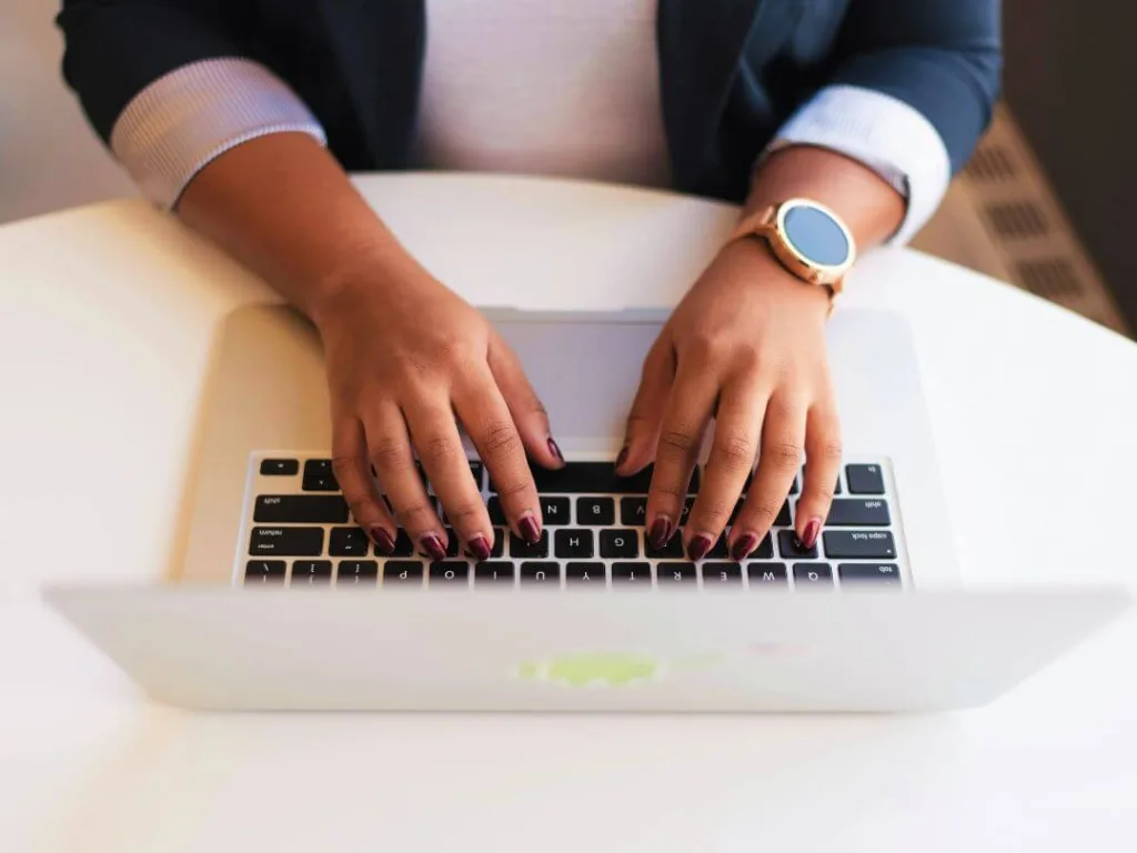 Person on computer working on a brand voice.