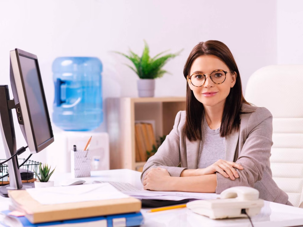 Corporate Branding How to Rebrand Your Company Successfully 3 1 – Azura Person at desk working on corporate branding.