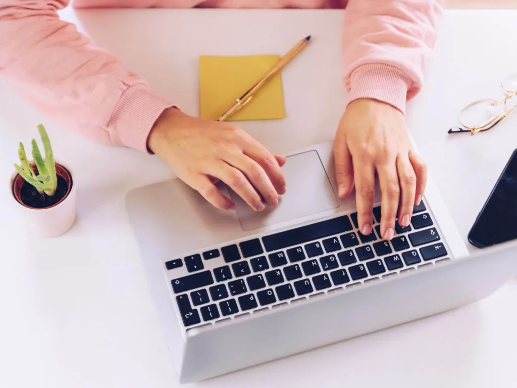 Person using laptop to learn about corporate influencers.
