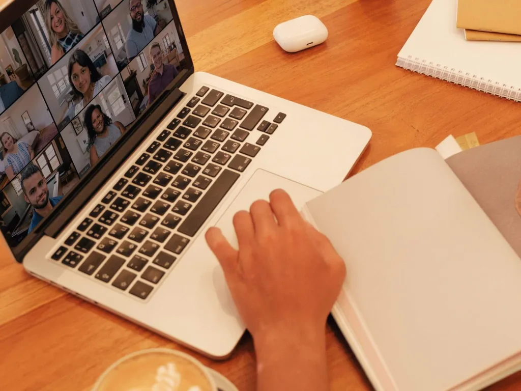 Person on laptop working on pinerest Marketing